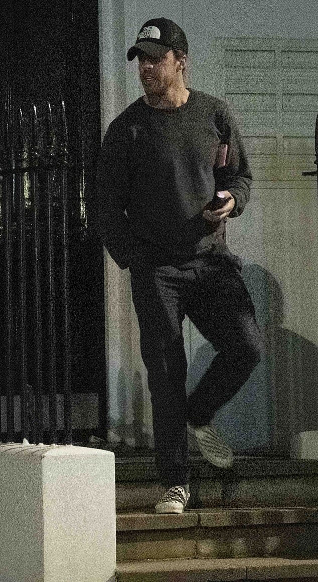 Getting out: Olly was spotted outside his West London home before returning with two coffees