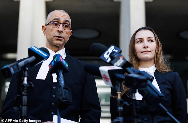 Crown attorneys Neville Golwalla (L) and Ana Serban speak to the media outside the Toronto Courthouse in Toronto on November 12, 2023 after former fashion mogul Peter Nygard was found guilty of four charges of sexual assault