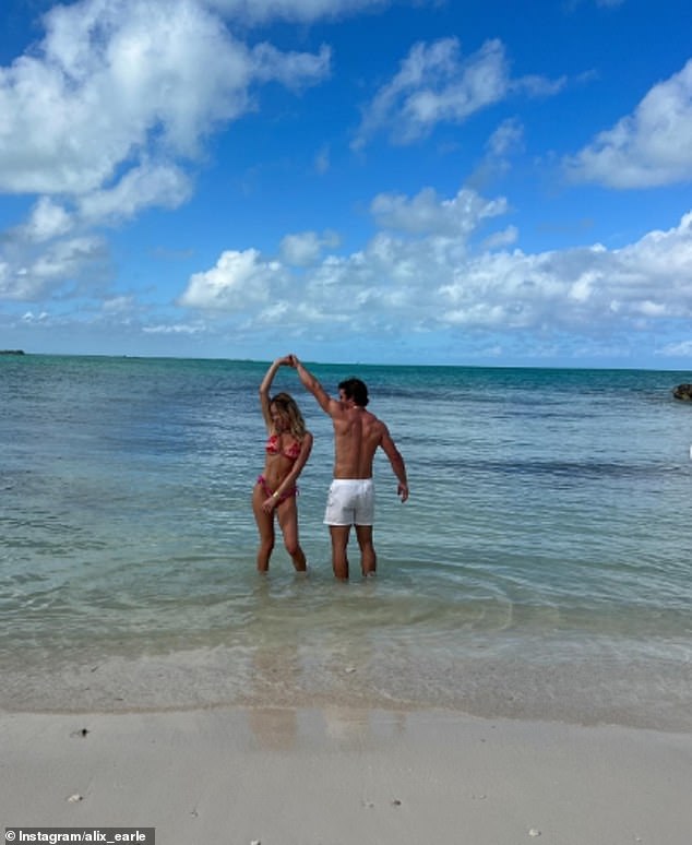 The couple was seen taking a dip in the sea and sharing drinks on the beach