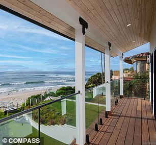 A private staircase leads to the white sandy beach below