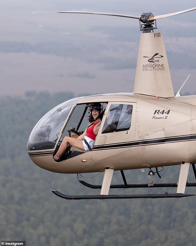 Another photo showed her in a helicopter in Litchfield National Park