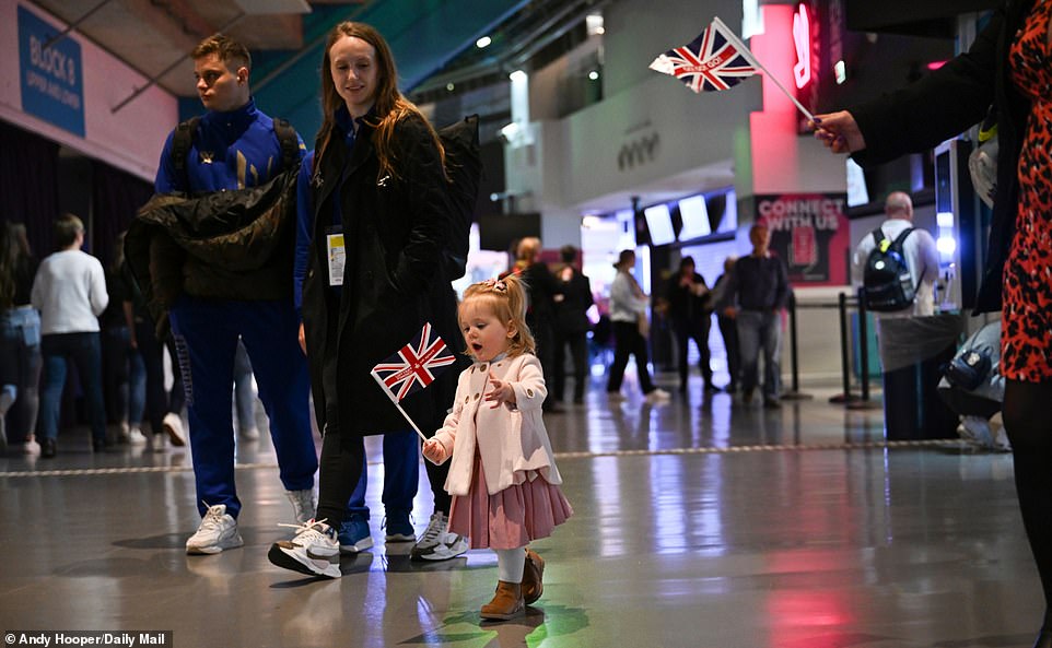 Fans arrive at Birmingham's Utilita Arena carrying Great Britain flags as tension begins to build