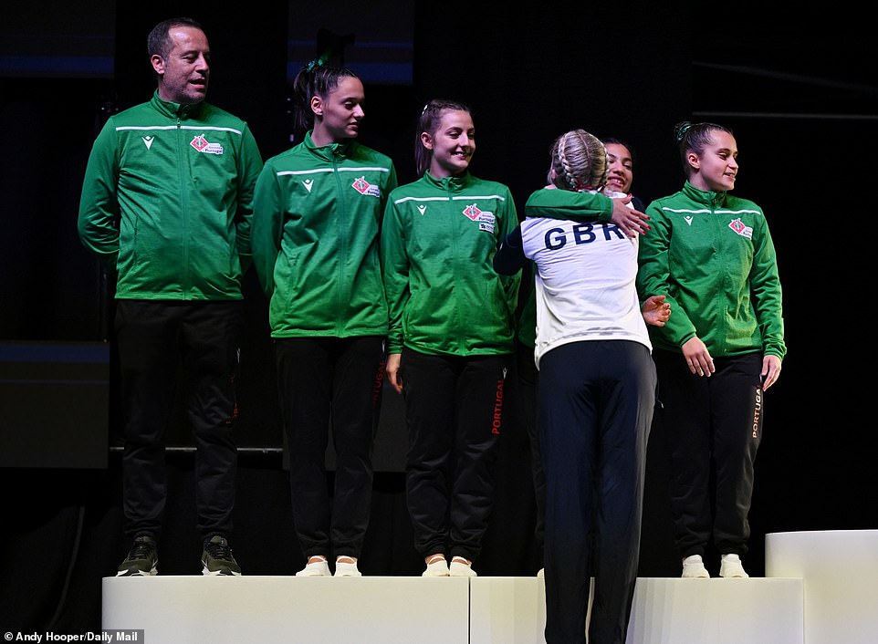 Williamson hugs the Portuguese team after they finished second behind Team GB and won the silver medal
