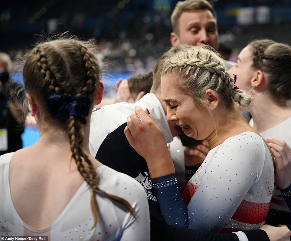 Williamson is overcome with emotion and reduced to tears as she is embraced by her Team GB teammates