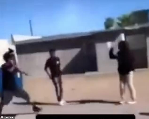 The second teenager, on the right, is then seen fighting off two more attackers