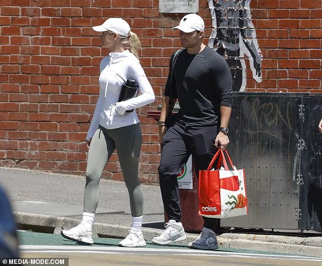 Meanwhile, Jackson showed off his toned gym body in a monochrome outfit consisting of a loose-fitting black sweater, matching pants and white sneakers