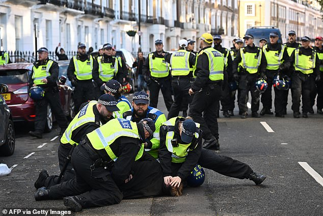 Police arrested a man during protests in central London on Saturday