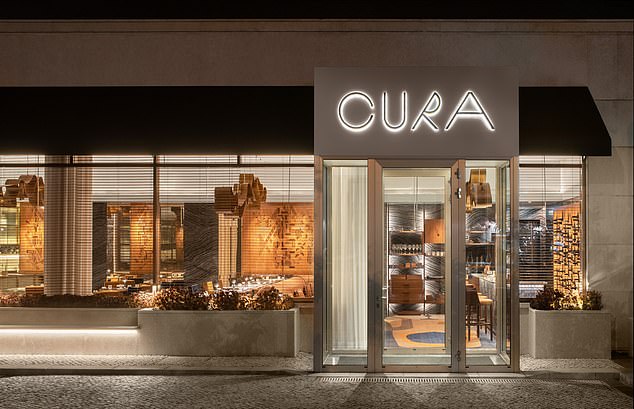 The street-level entrance to Cura, a restaurant Ted describes as 