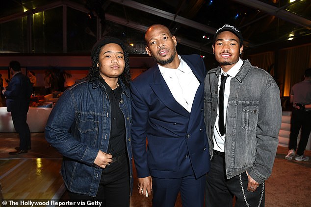 Proud: The comedian shared that his upcoming new stand-up show would be titled Skittles of Rainbow Child and would focus on his experiences related to his eldest's transition (photo from left to right: Kai Wayans, Marlon Wayans, Shawn Wayans )