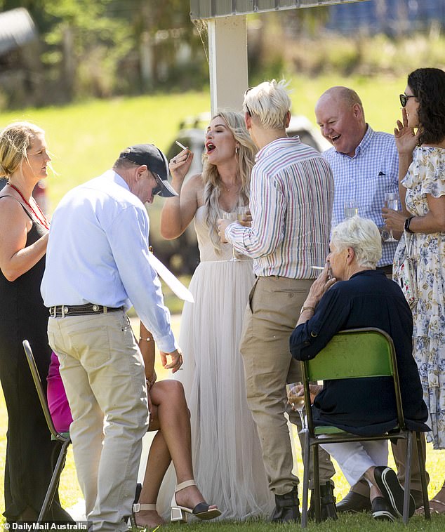 Vikki Campion smoked a cigarette with guests at her own wedding reception on Sunday (photo)