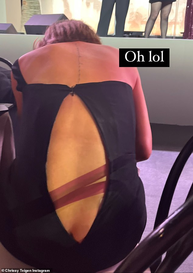Oops: The situation changed when the 37-year-old model's dress split open at the back after her zipper opened