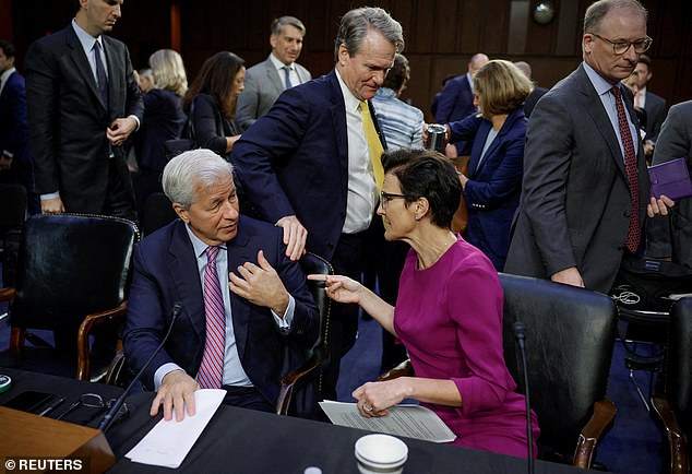 JPMorgan CEO Jamie Dimon previously told lawmakers it would be unreasonable to refund transfers that customers were tricked into approving.  Pictured: Dimon, left, and Citigroup CEO Jane Fraser, right, during a Senate Fraud Hearing in Washington in September 2022