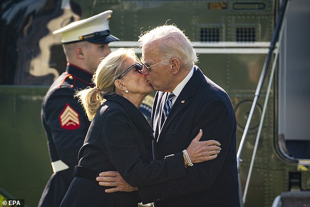 President Joe Biden and First Lady Jill Biden kiss on the South Lawn of the White House after arriving on Marine One following their weekend in Wilmington, Del.