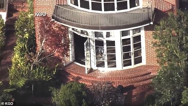 Aerial footage showed broken windows and shattered glass at the back door of Pelosi's home