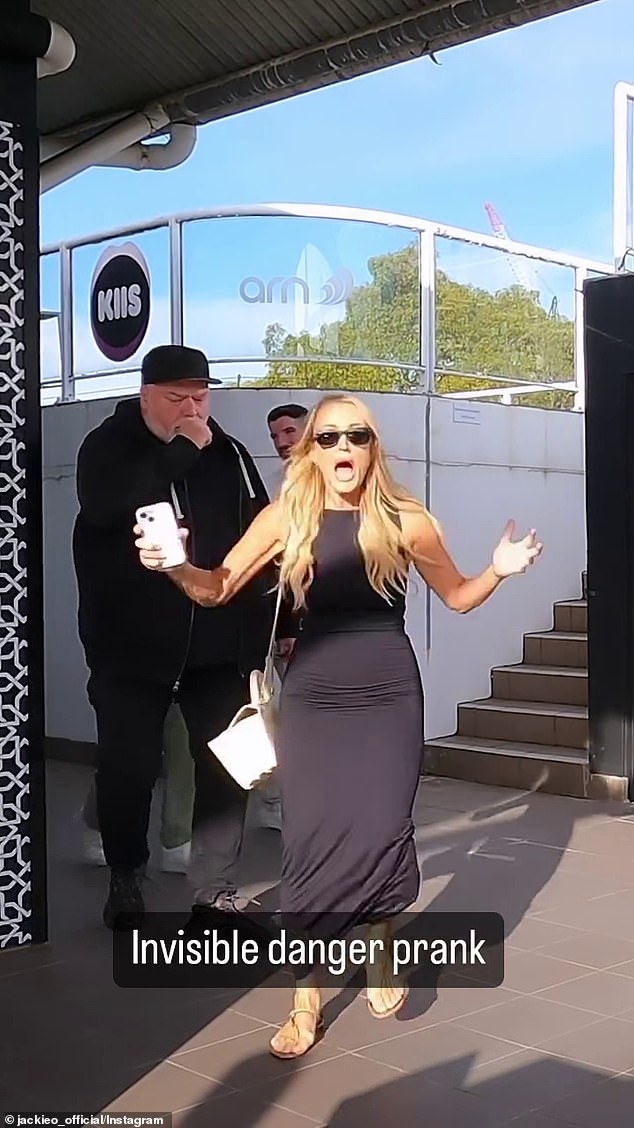 Jackie is seen leading Kyle Sandilands (pictured left) outside when she suddenly starts screaming.  Kyle is shocked when Jackie runs away.  After composing himself, Kyle says 