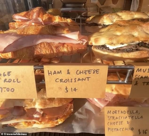 Disappointed customer snapped a ham and cheese croissant at a Melbourne cafe for a whopping $14 (pictured)