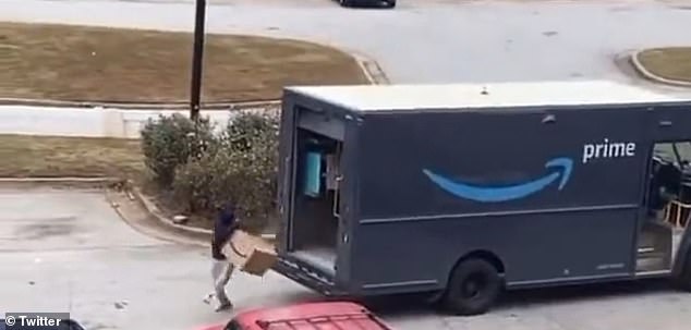 Suddenly, another thief jumps down from behind and stumbles as a large box escapes his hands and partially opens just before he fixes it and runs away.