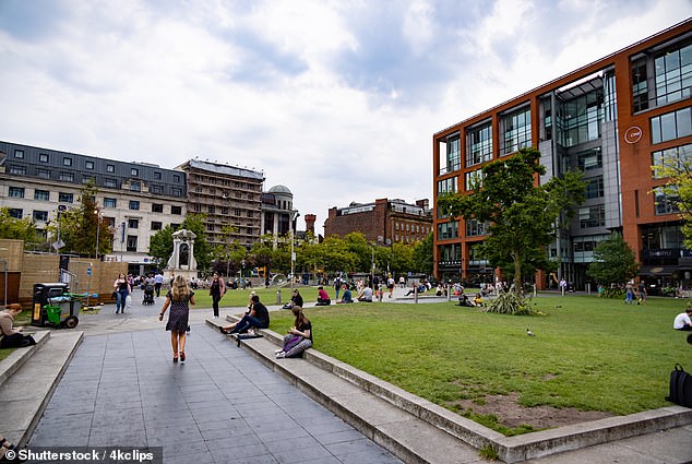 The 20-year-old victim was on holiday in Britain in an alley after talking to her as she walked through the city's Piccadilly Gardens (pictured)