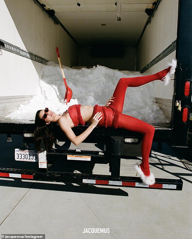 Relaxed: at one point she put on a pair of retro sunglasses with red frames and lay down on the edge of the truck with one of her feet kicked up