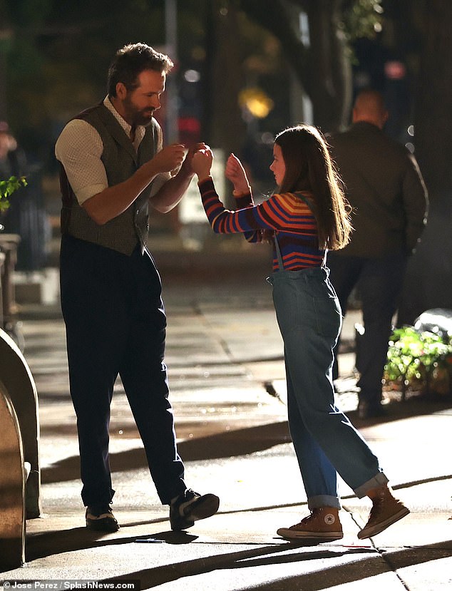 Fist bump: The pair appeared to have destroyed a scene as they celebrated together