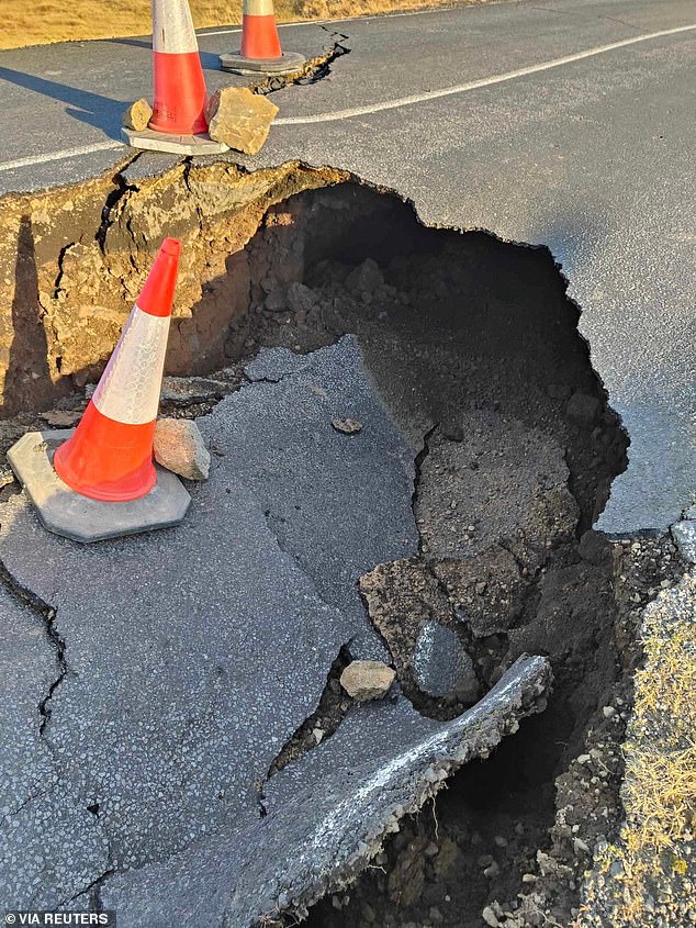 Due to volcanic activity, huge sinkholes have formed in a road near Grindavik