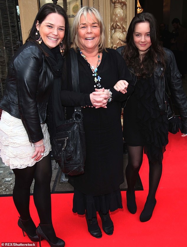 Family: Linda and Mark share children Louis, 31, and Roberta, 27 (photo: Linda with her daughters in 2011)