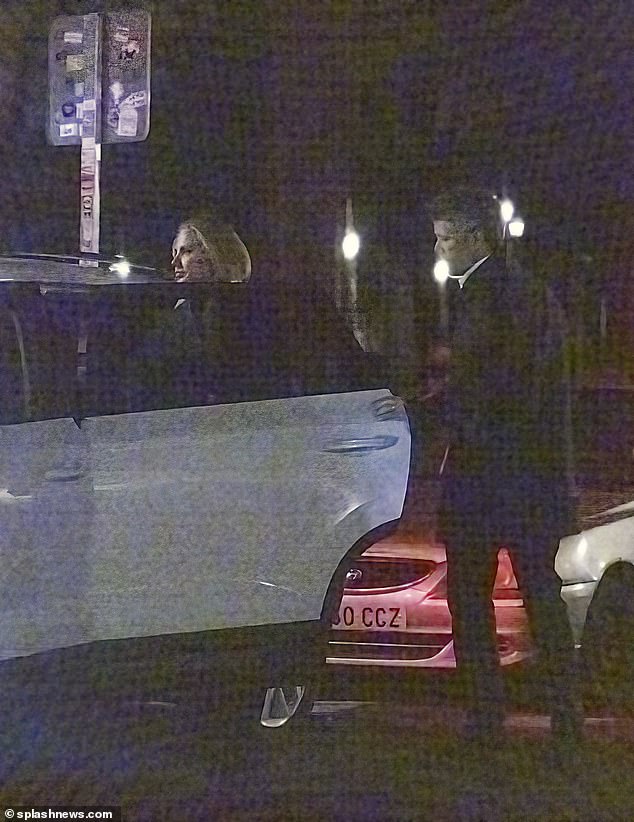 The royal family opens the taxi door so Genoveva can get into the backseat after they leave the restaurant