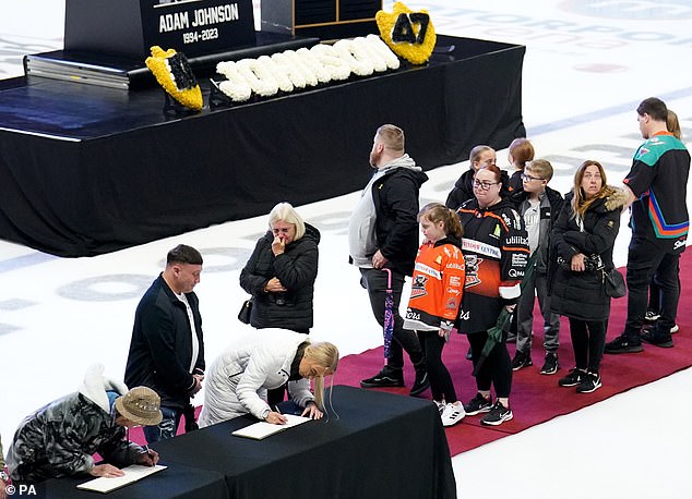 Supporters lined up to sign a book of condolence for Johnson's family, many of whom attended the fateful match