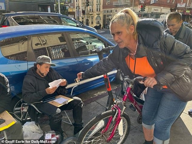 Sandra Case is among those who lined up Monday to get tested for COVID-19 and receive $5.  She called on visiting dignitaries to look at the 