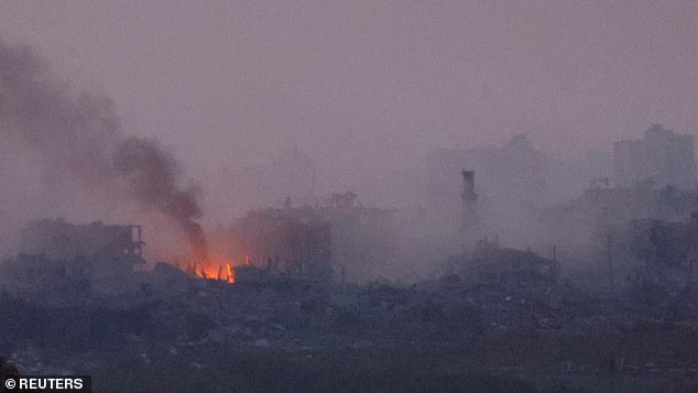 Smoke rises over Gaza on Tuesday.  Israel has been carrying out heavy bombing since October 7, when Hamas terrorists spread out of the area and killed at least 1,200 people.