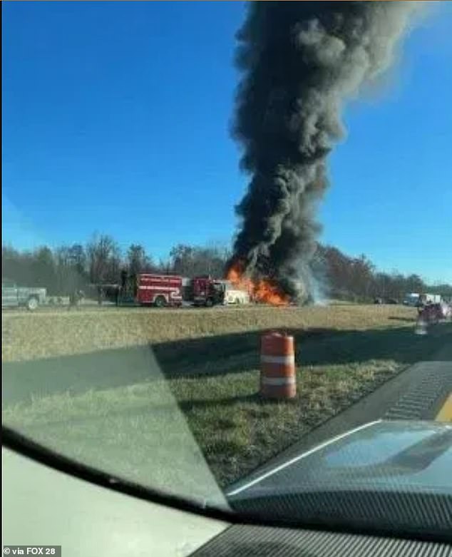 Images from the scene show the back of the bus completely engulfed in flames