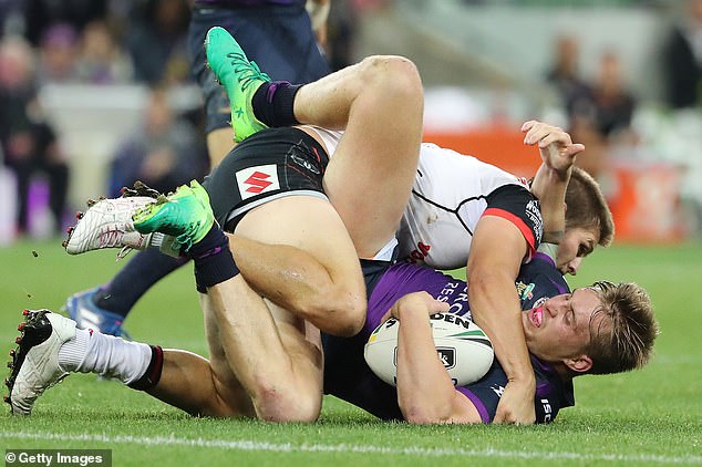 Cameron Munster from Melbourne is drilled in a heavy tackle in the commercial, which is already airing in America