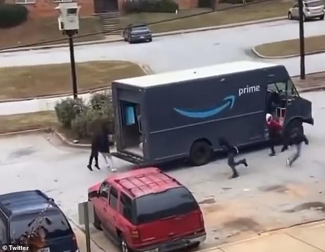 Some of the young thieves (pictured) emerged from the truck, while the others immediately sat in the back of the open van