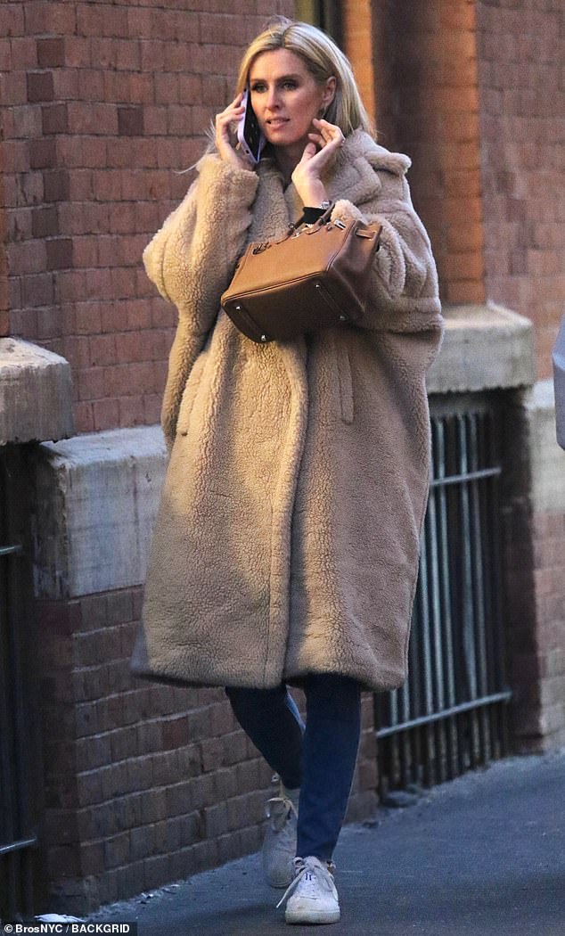 Staying warm: The social media personality, who recently attended a fashion-forward event in the Big Apple, wore an oversized tan overcoat