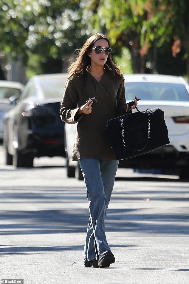 The jewelry designer looked radiant as she showed off her chic sense of style in a structured blazer and light-wash flared jeans