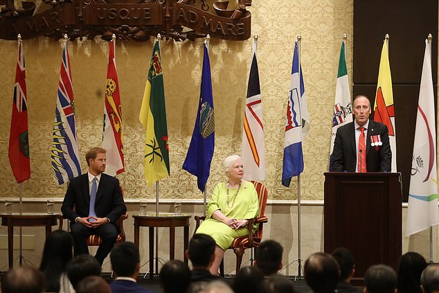 Prince Harry and Lieutenant Governor of Ontario Elizabeth Dowdeswell listen to Peter Lawless on stage during The Duke Edinburgh's International Gold Award Winners Ceremony on Day 2 of the Invictus Games, 2017