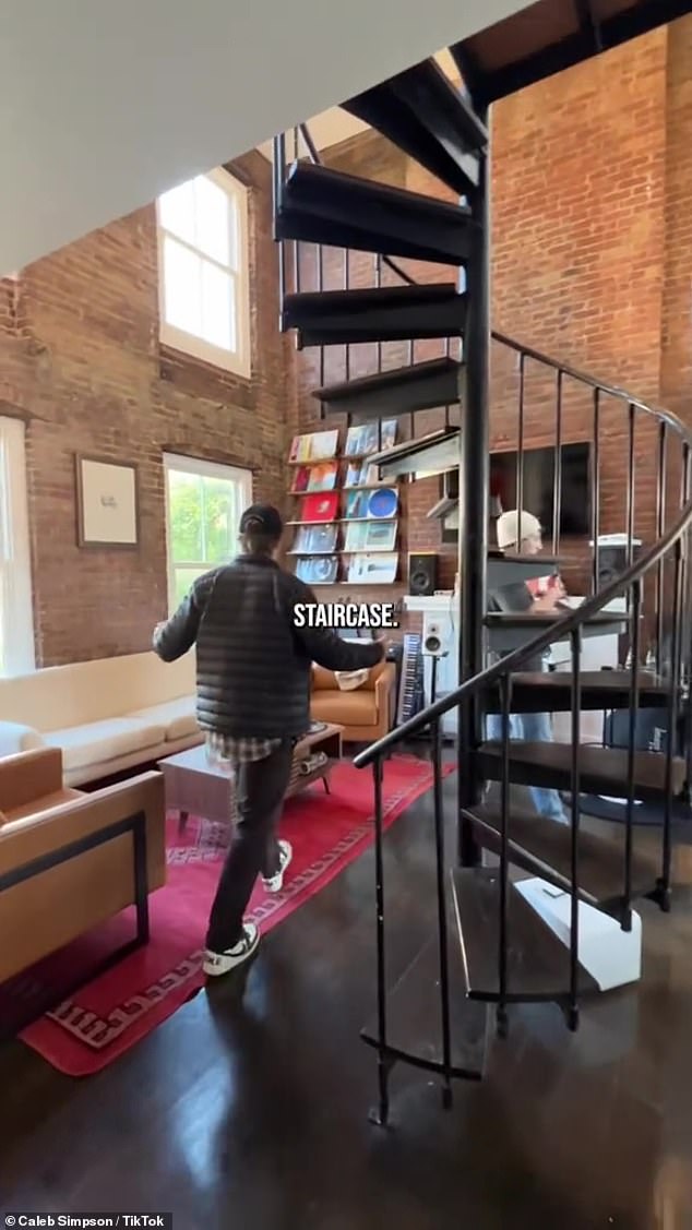 Wow!  There is a black spiral staircase in the center of the apartment