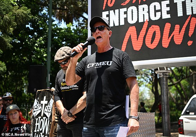 CFMEU State Secretary Michael Ravbar (centre) accused the state government of 'failing to modernize' its safety regulations during a meeting in Brisbane on Wednesday