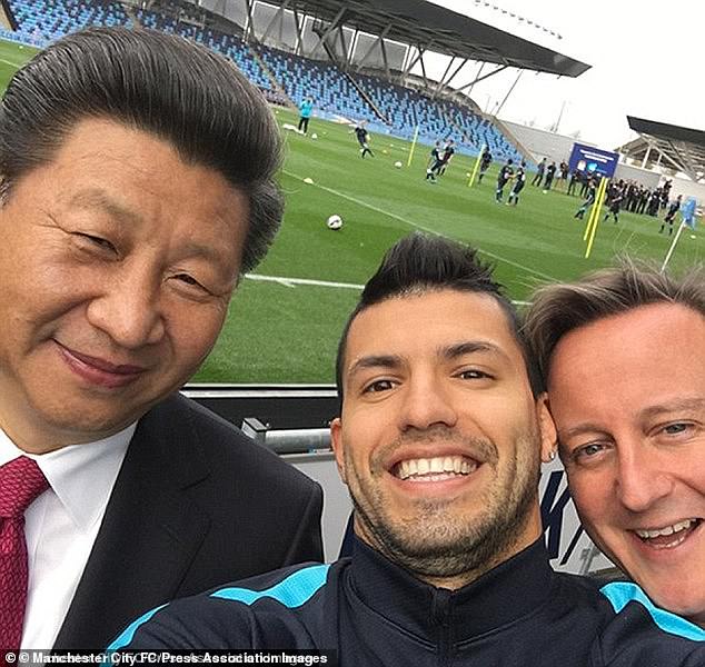 Xi Jinping meets Manchester City striker Sergio Aguero and David Cameron during his trip to Britain in October 2015, billed as the 'dawn of a golden age' of relations