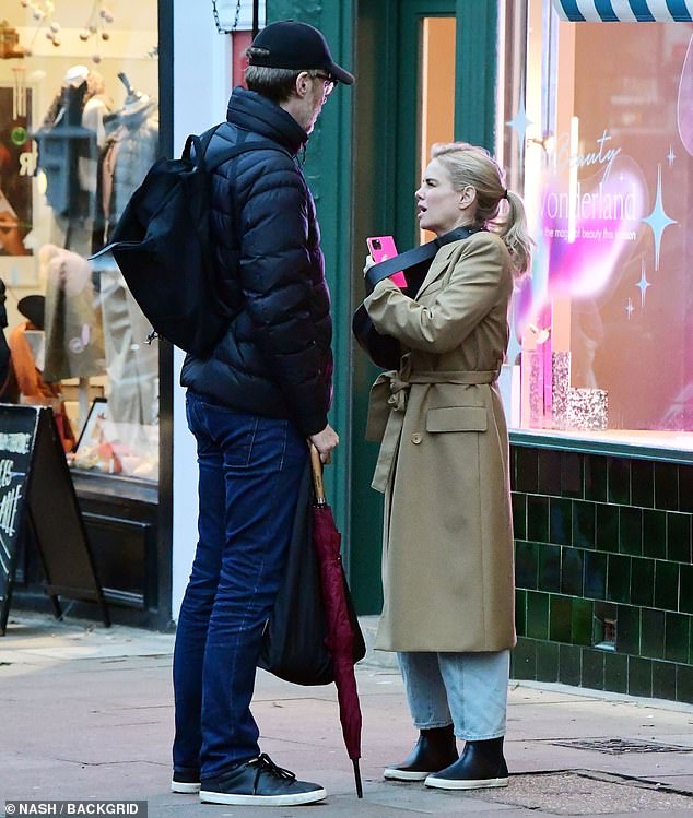 In love: his 6ft body towers over her little flame - she is 6ft tall