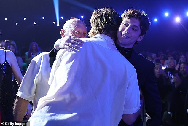 Later, as he collected the night's biggest award for best solo artist, Troye said he is 