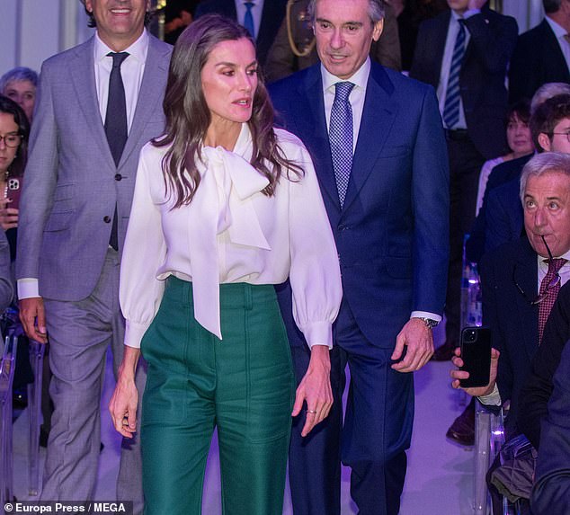 Letizia turned heads when she paired the outfit with nude stilettos and her chocolate brown locks hung in loose waves around her shoulders