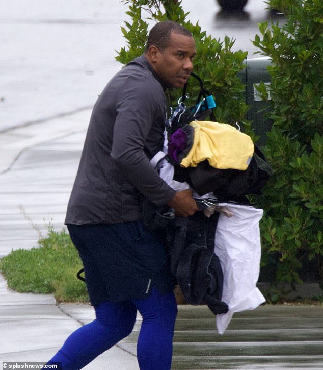 Dirty laundry: The actor, 58, was spotted carrying a large load of dirty laundry while in Westlake Village on Wednesday