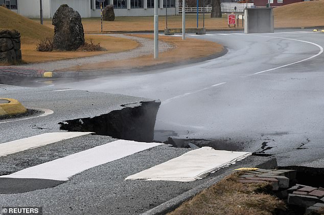 A road was damaged in the village of Grindavik, which was evacuated on Tuesday due to volcanic activity, in Iceland