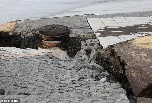 A road has been damaged in the village of Grindavik, which was evacuated due to volcanic activity