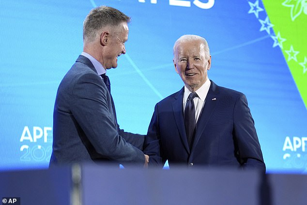 President Joe Biden shakes hands after Golden State Warriors head basketball coach Steve Kerr introduced him during a welcome reception for leaders of the Asia-Pacific Economic Cooperative at the Exploratorium in San Francisco, Wednesday, November 15, 2023