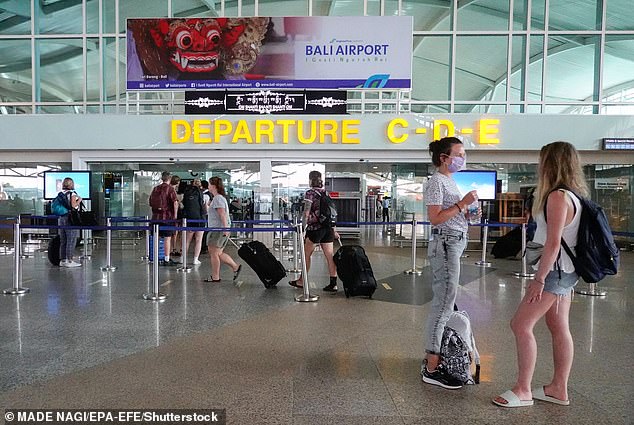 Indonesian officials arrested five immigration officers at Ngurah Rai International Airport (pictured) for allegedly charging arriving tourists to use the priority lane to speed them through the airport