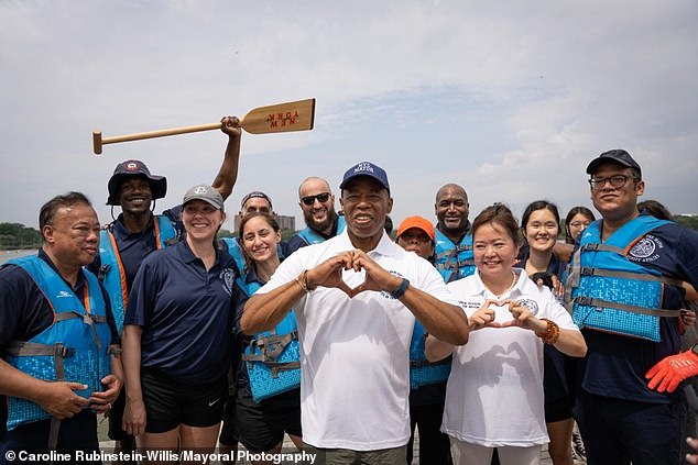 Adams poses with consultant Winnie Greco at the Hong Kong Dragon Boat Festival in August