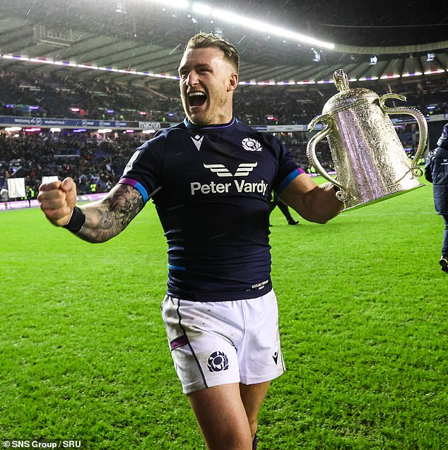 Stuart Hogg celebrates with the Calcutta Cup during a Guinness Six Nations match between Scotland and England last year.  He represented his country 100 times