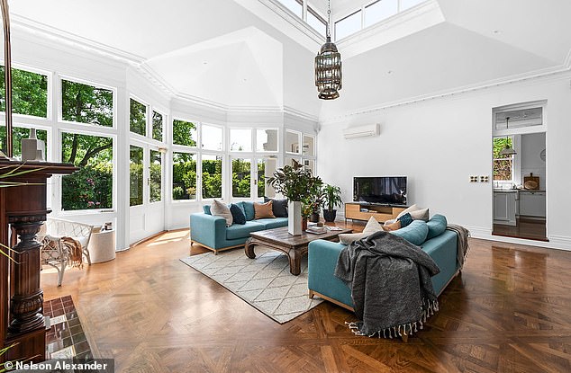 Highlights include high ceilings, ornate finishes, Baltic pine floors and multiple open marble fireplaces.  In the photo: one of the various lounge areas in the country house